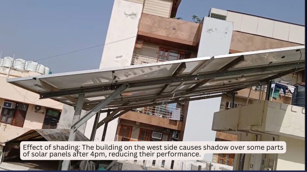 Partial shading on rooftop solar panels caused by a nearby building in the evening, reducing solar system performance after 4 PM.